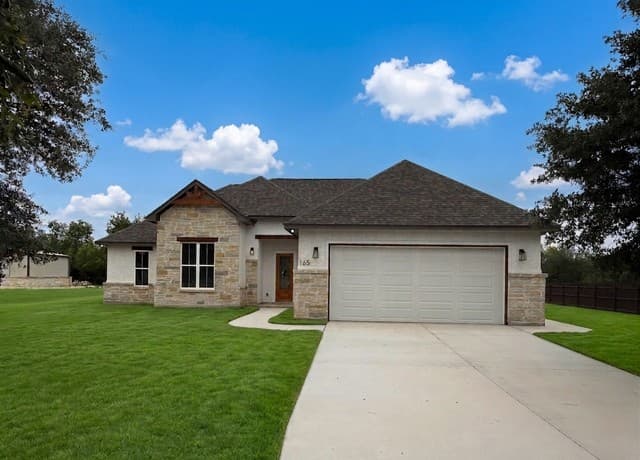 4-bedroom rental at 165 E Short Meadow Dr in Lytle, TX — photo 1
